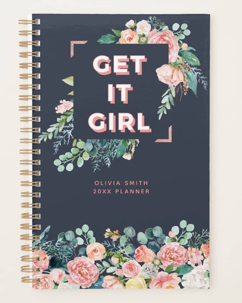 Dark blue planner with pink floral design and the words Get It Girl.