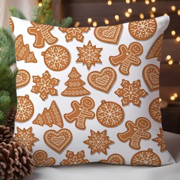 White Pillow With A Repeating Pattern Of Gingerbread Cookies In Various Shapes.