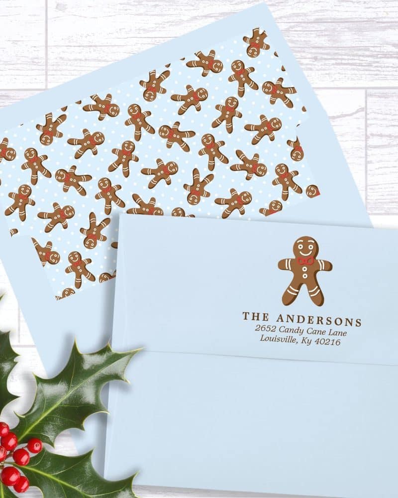 Light blue envelope with a gingerbread man return address label and a gingerbread man patterned liner.