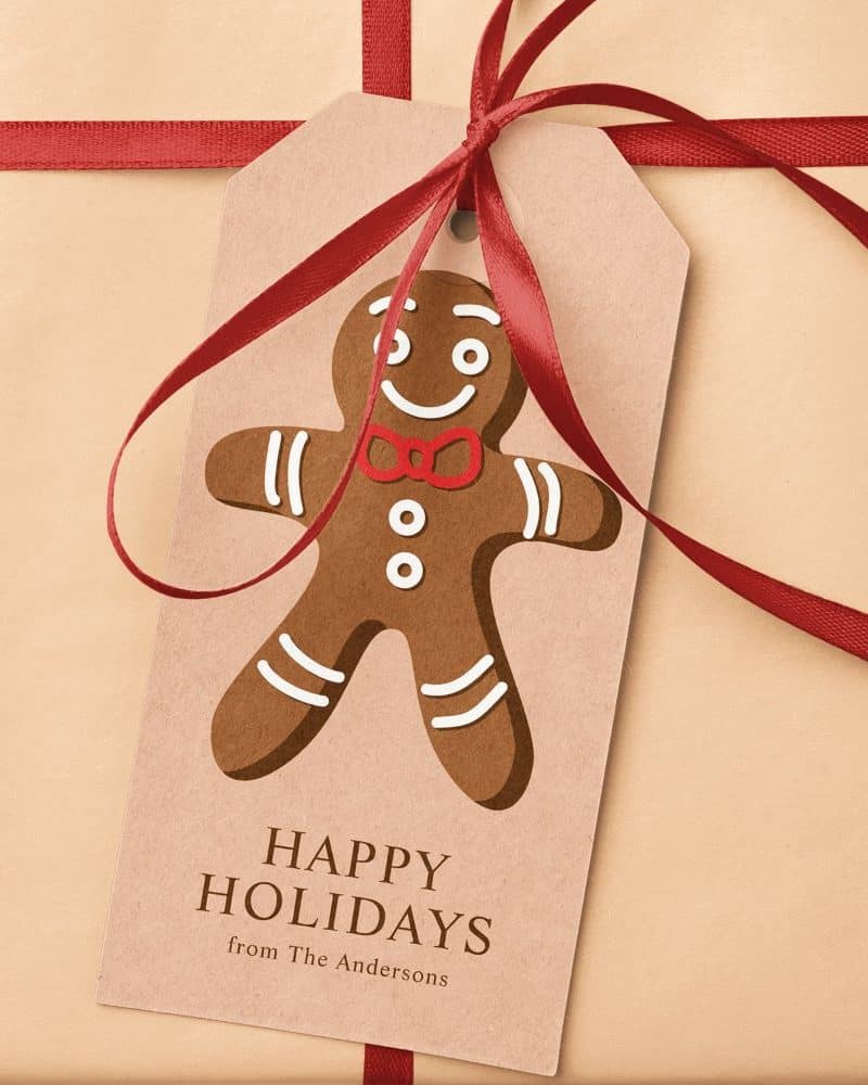 Gift tag with a gingerbread man illustration and Happy Holidays message from the Andersons.