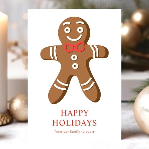 Holiday Greeting Card Featuring A Gingerbread Man Wearing A Bow Tie. The Card Reads Happy Holidays From Our Family To Yours.