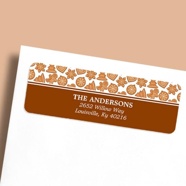 Return Address Label With A Brown Background, Gingerbread Cookie Design, And The Andersons' Address.