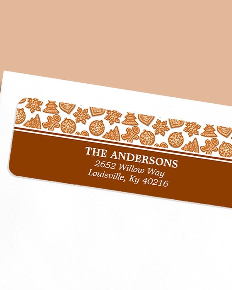Return address label with a brown background, gingerbread cookie design, and The Andersons' address.