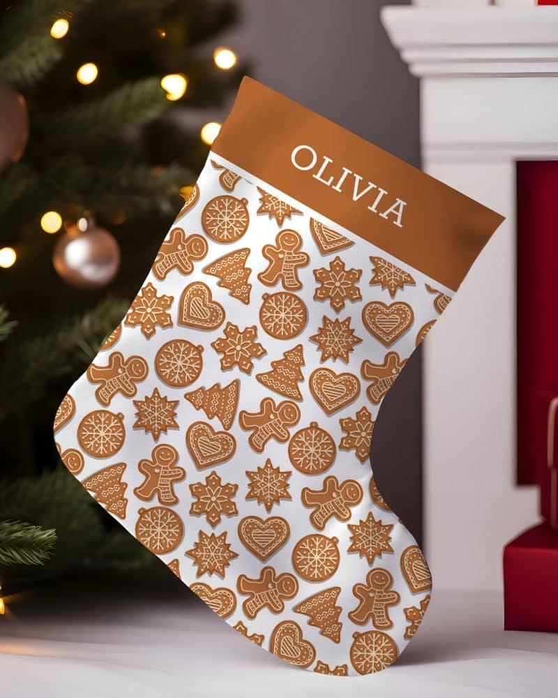 Personalized Christmas stocking with a gingerbread cookie pattern, Olivia's name at the top.