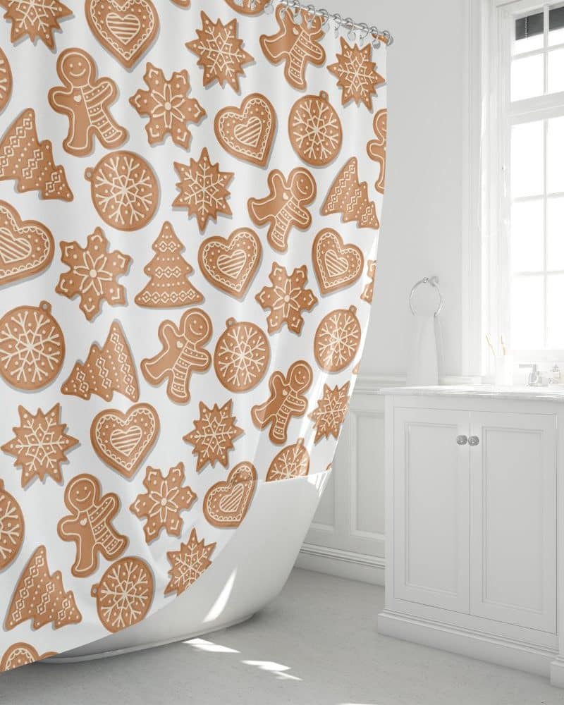 Shower curtain with a pattern of gingerbread cookies in various shapes including men, stars, hearts, and trees.