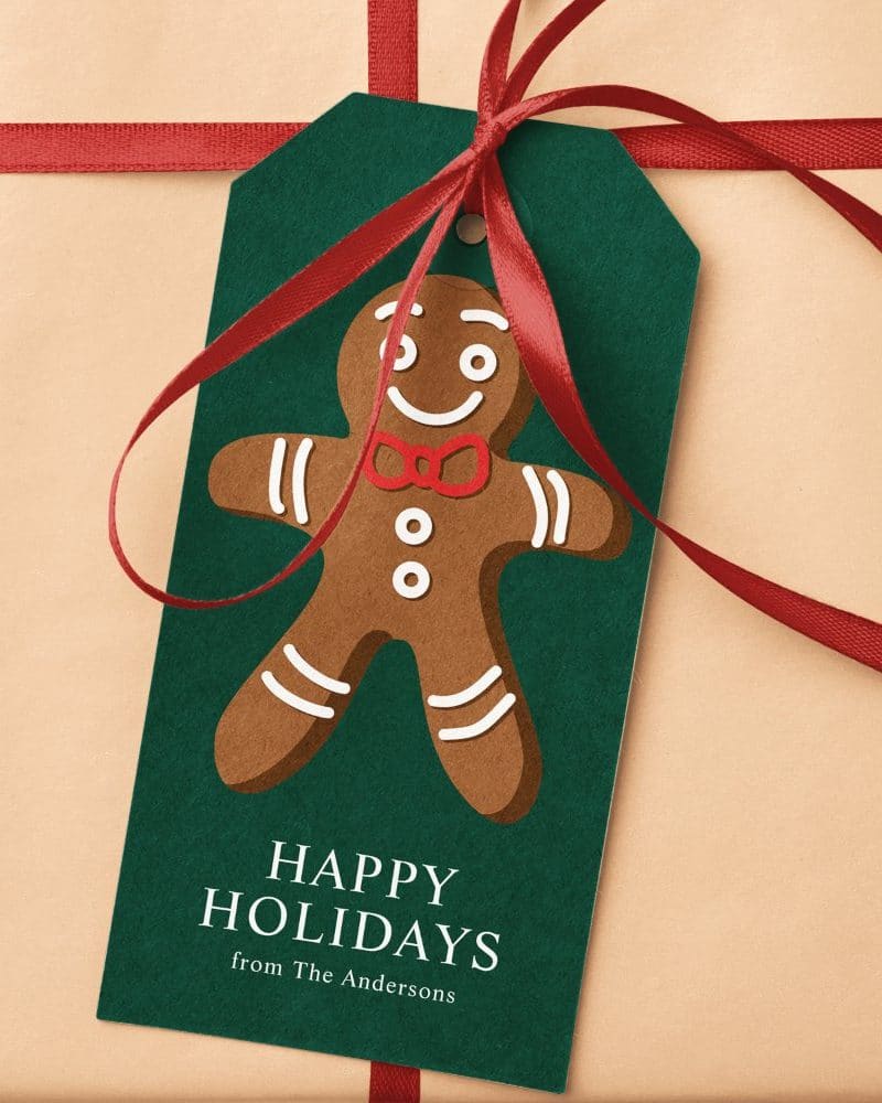 Green gift tag with a gingerbread man and Happy Holidays message from the Andersons.