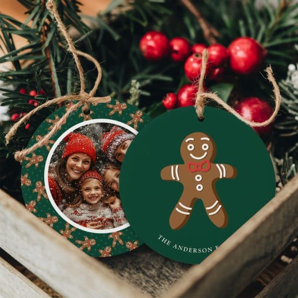 Two Round Christmas Ornaments. One Features A Family Photo Surrounded By Gingerbread Men. The Other Shows A Single Gingerbread Man And The Text The Anderson Family.