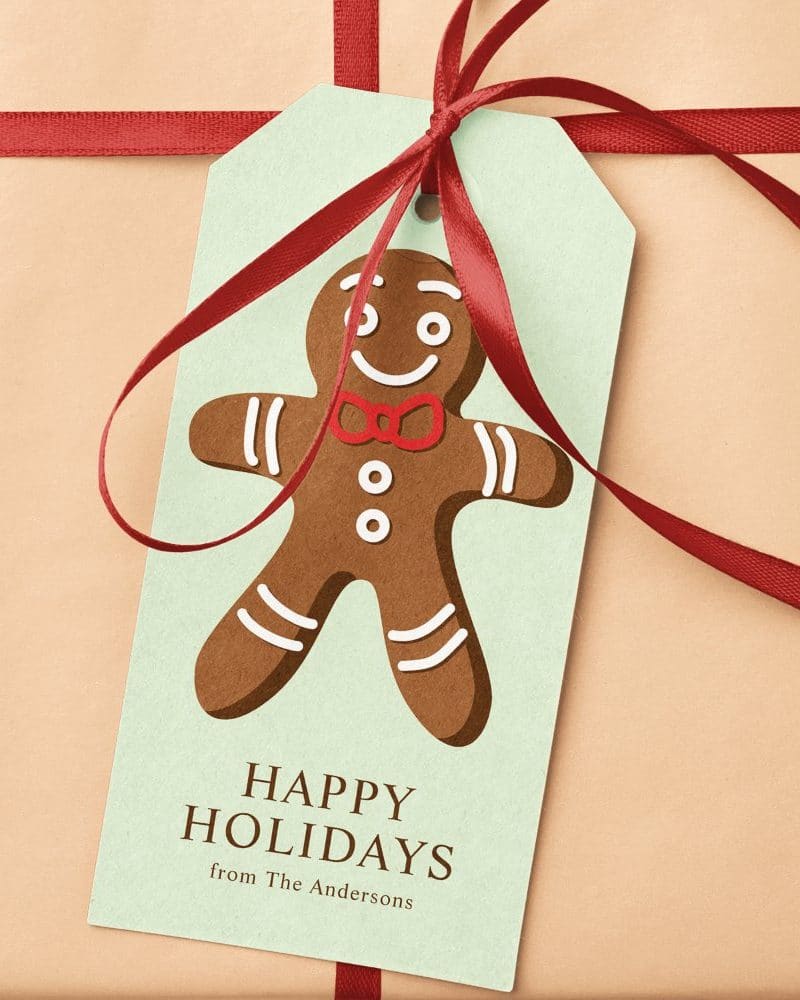 Gift tag with a gingerbread man design, wishing happy holidays from the Andersons.