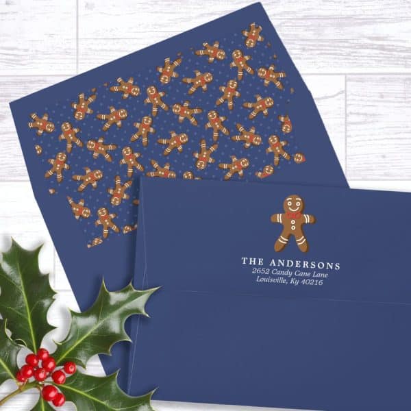 A Navy Blue Envelope With A Gingerbread Man Design And Address.