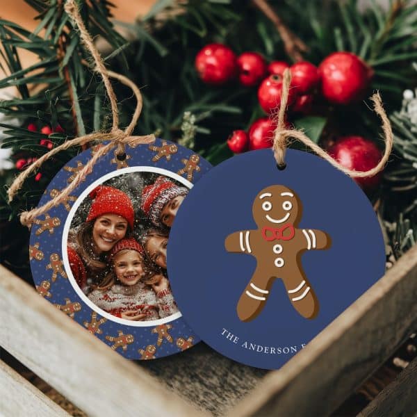 Two Round Christmas Ornaments. One Features A Family Photo Surrounded By Gingerbread Men. The Other Shows A Single Gingerbread Man And The Name Anderson.