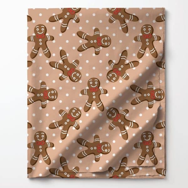 Tan Fabric With A Repeating Pattern Of Gingerbread Men And White Dots.