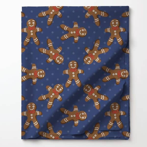 Blue Fabric With A Repeating Pattern Of Gingerbread Men Wearing Red Bow Ties.