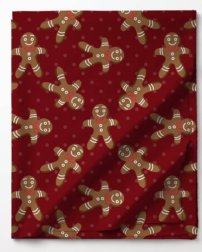 Red fabric with a repeating pattern of gingerbread men.