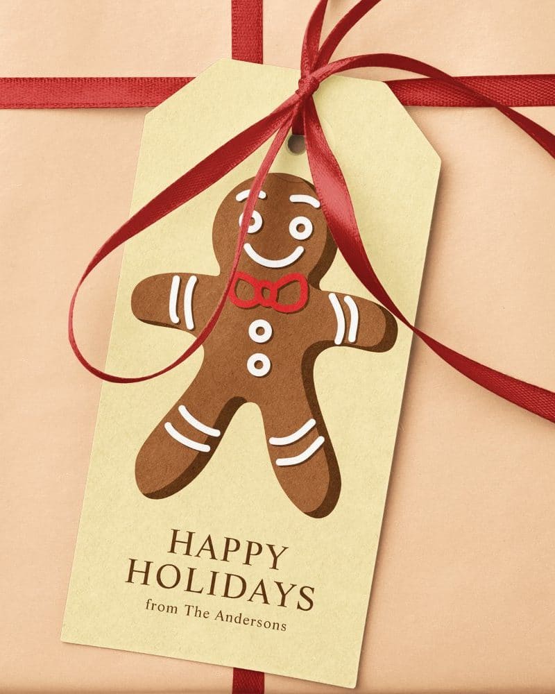 Gift tag with a gingerbread man illustration, saying Happy Holidays from The Andersons.
