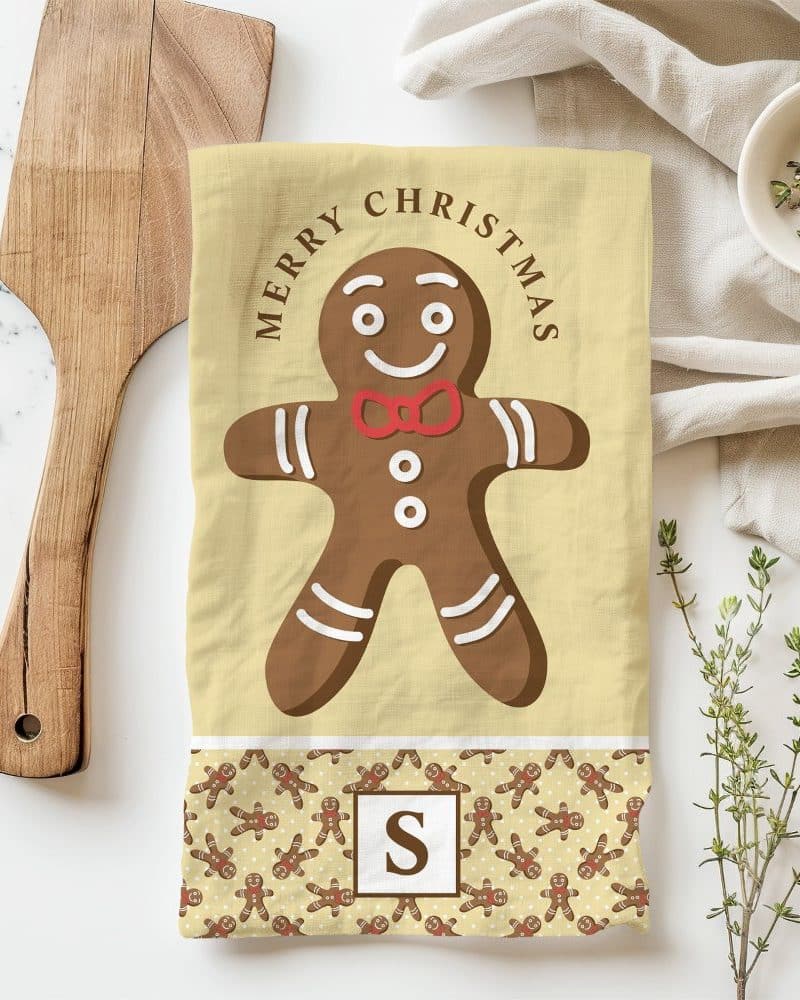 Christmas tea towel featuring a large gingerbread man and the words Merry Christmas.
