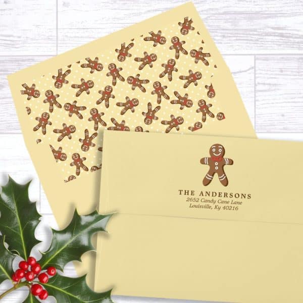 A Pale Yellow Return Address Label With A Gingerbread Man Graphic And The Andersons Family Address.
