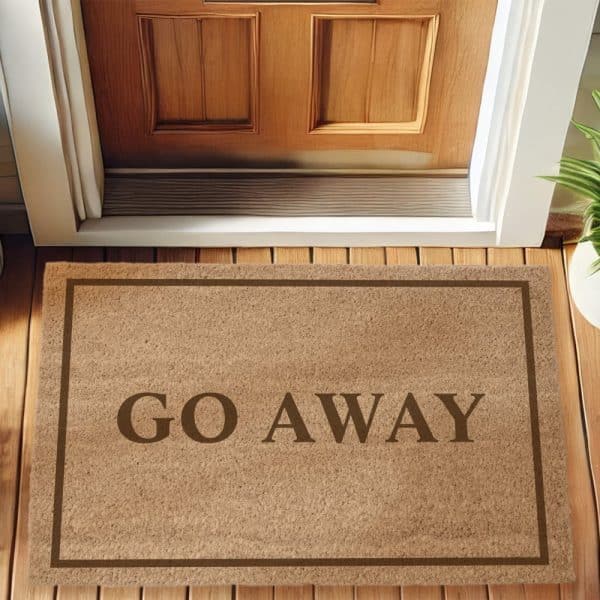 Tan Doormat With The Words Go Away In Dark Brown Lettering.