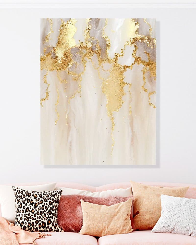 Abstract painting of gold and beige flowing patterns.