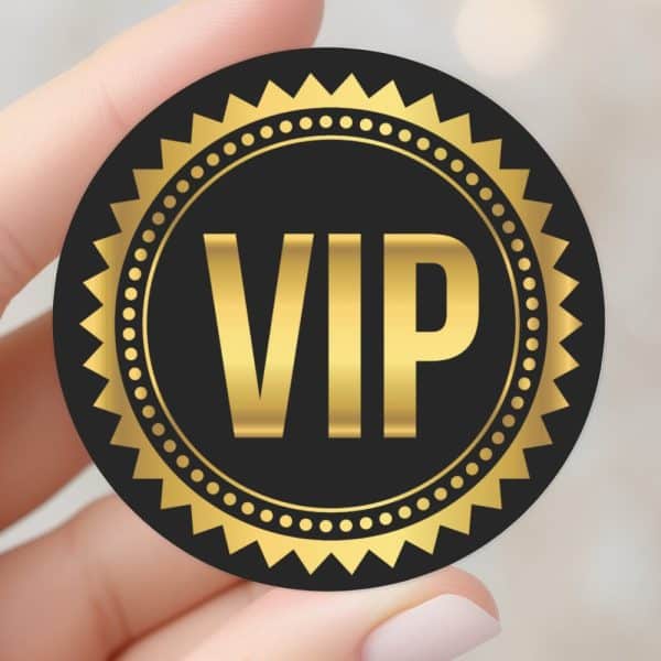 Black Circle Sticker With Gold Vip Lettering And Border.