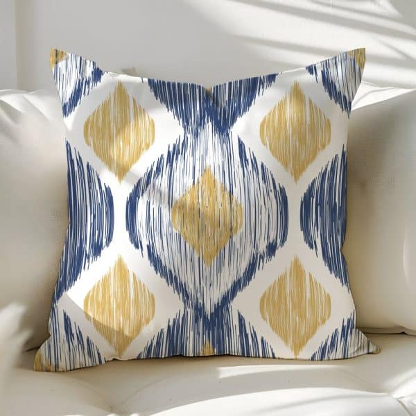 Decorative Throw Pillow With A Blue And Gold Ikat Pattern.