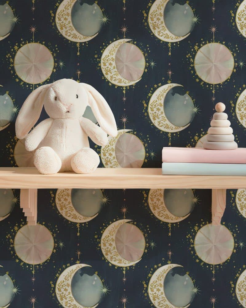 White bunny rabbit sitting on a shelf against a dark blue moon and stars wallpaper.