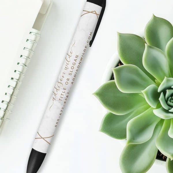 Marble-Patterned Pen With Gold Lettering And Contact Information.