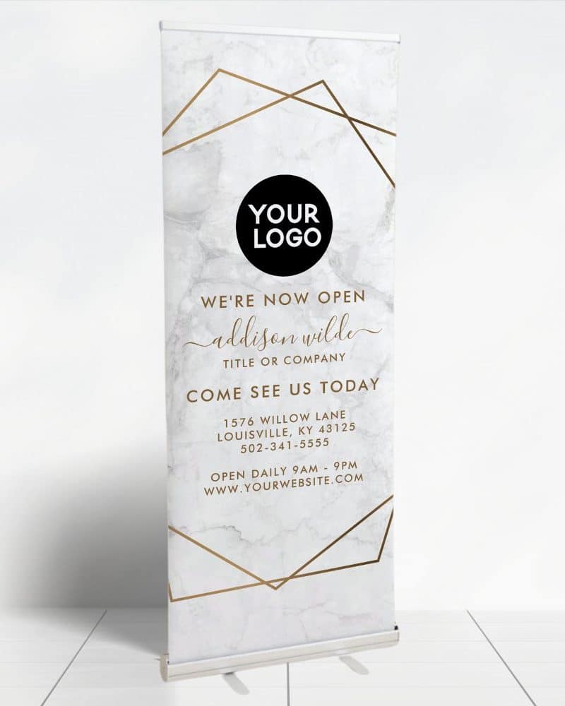 Retractable banner announcing a new business opening, featuring a marble background, gold geometric design, and business information.