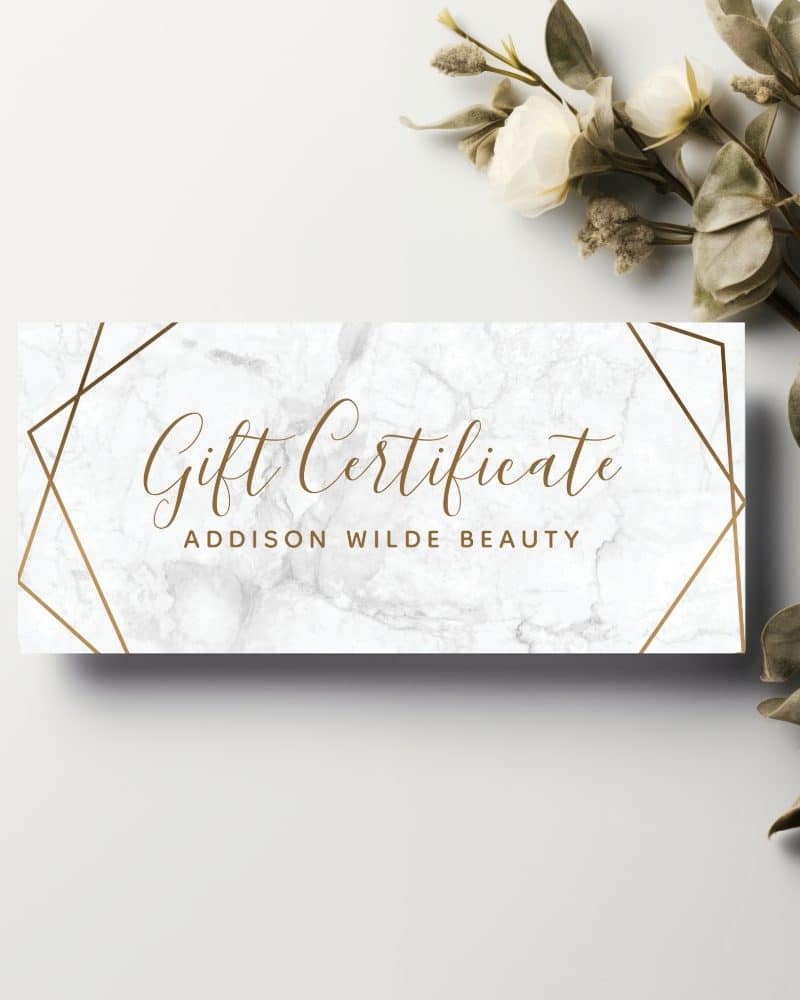 Addison Wilde Beauty gift certificate with marble background and gold geometric design.