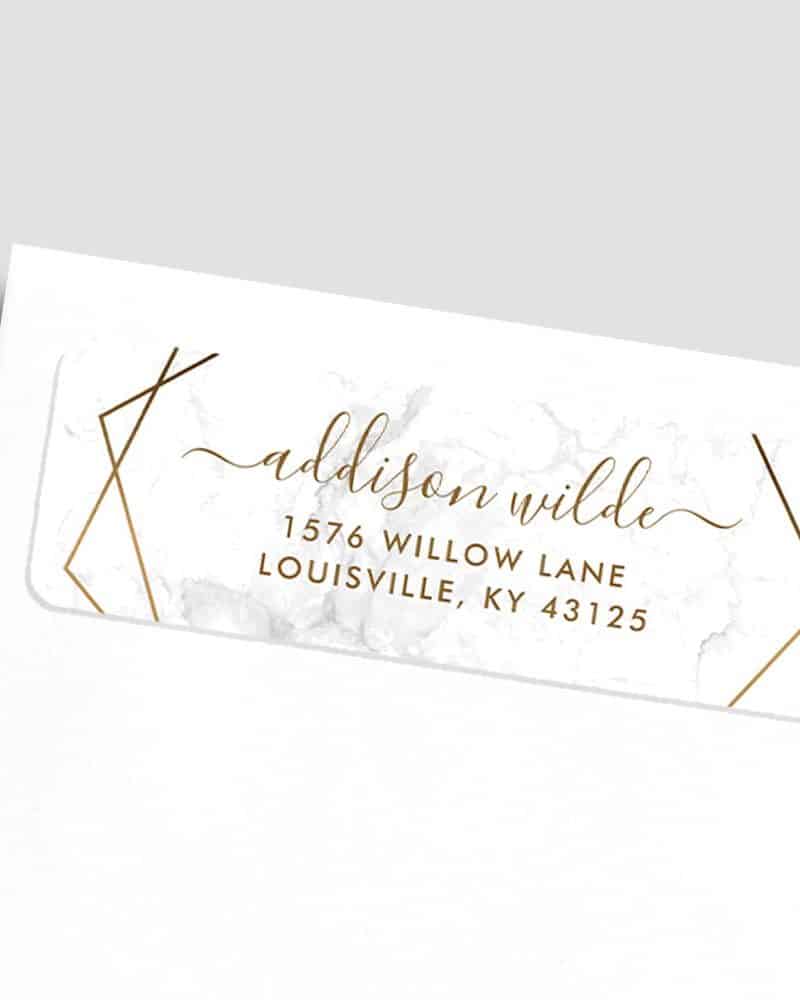 Return address label: Addison Wilde, address and zip code on marble background with gold geometric lines.