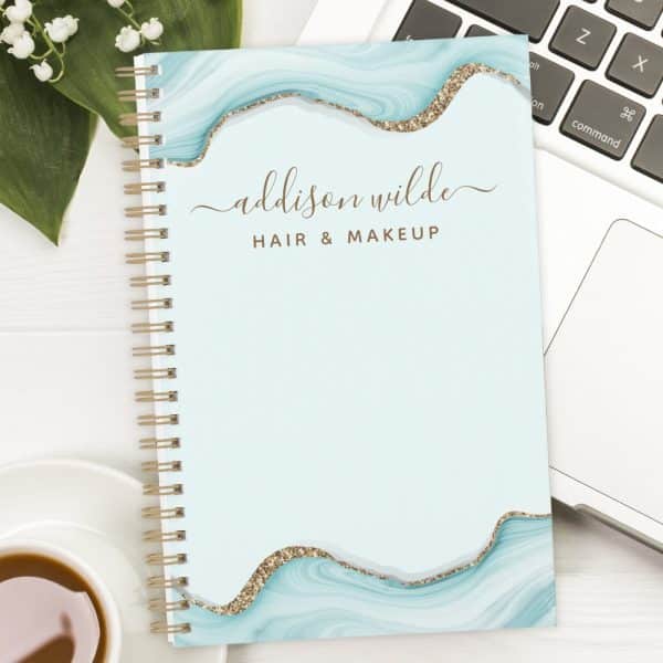 Spiral-Bound Notebook With A Light Blue Marble Design, Gold Glitter Accents, And The Name Addison Wilde Hair &Amp; Makeup.