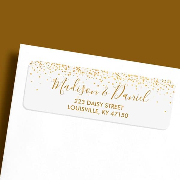 White Return Address Label With Gold Confetti And The Names Madison &Amp; Daniel, And Their Address.