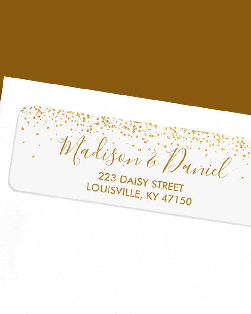 White return address label with gold confetti and the names Madison & Daniel, and their address.