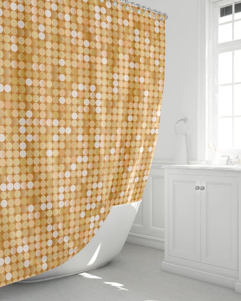 Gold and off-white polka dot shower curtain in a bathroom.