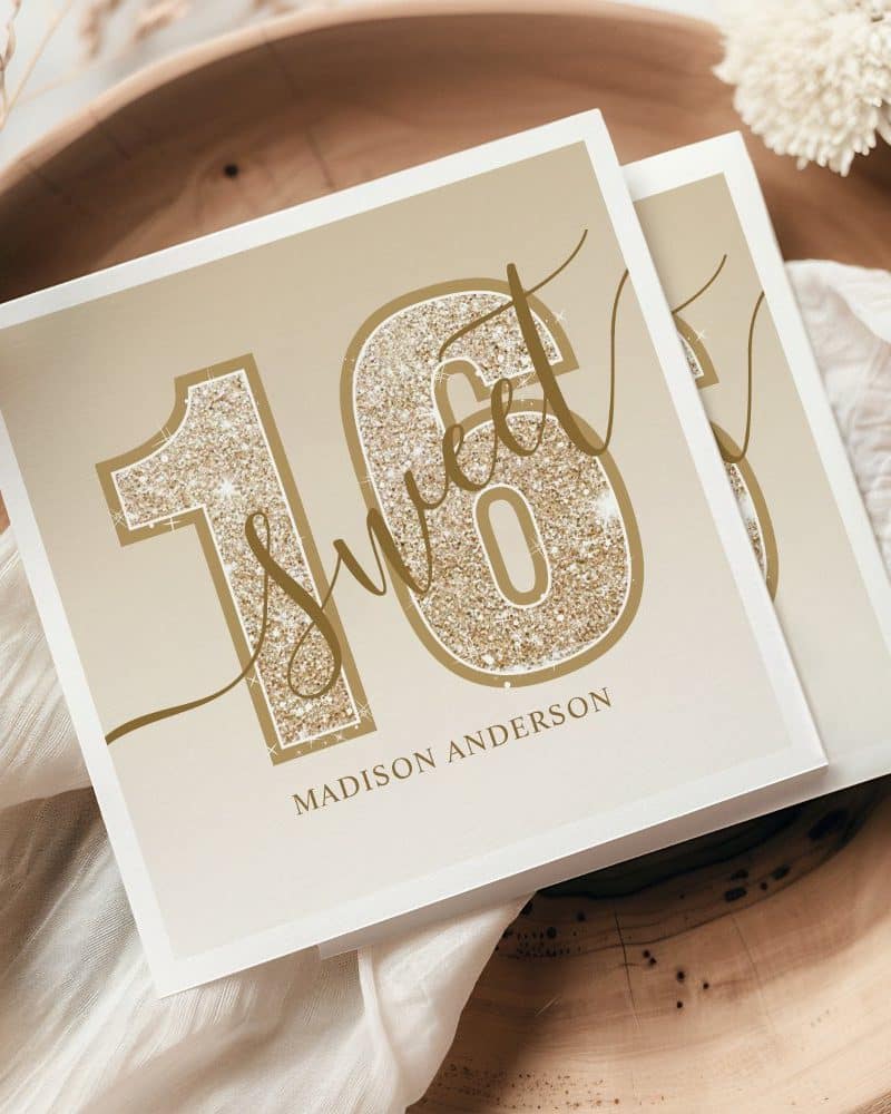 Sweet sixteen invitation with gold glitter numbers and Madison Anderson's name.