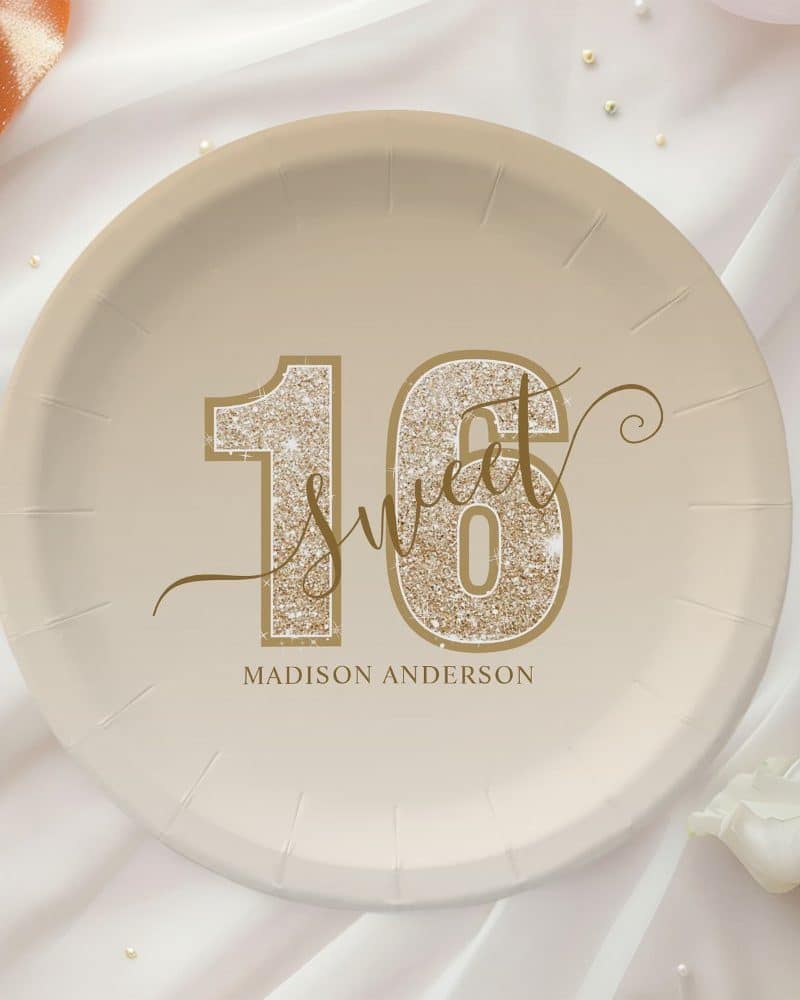 Beige paper plate with gold glitter sixteen and Sweet 16 design, personalized with Madison Anderson.