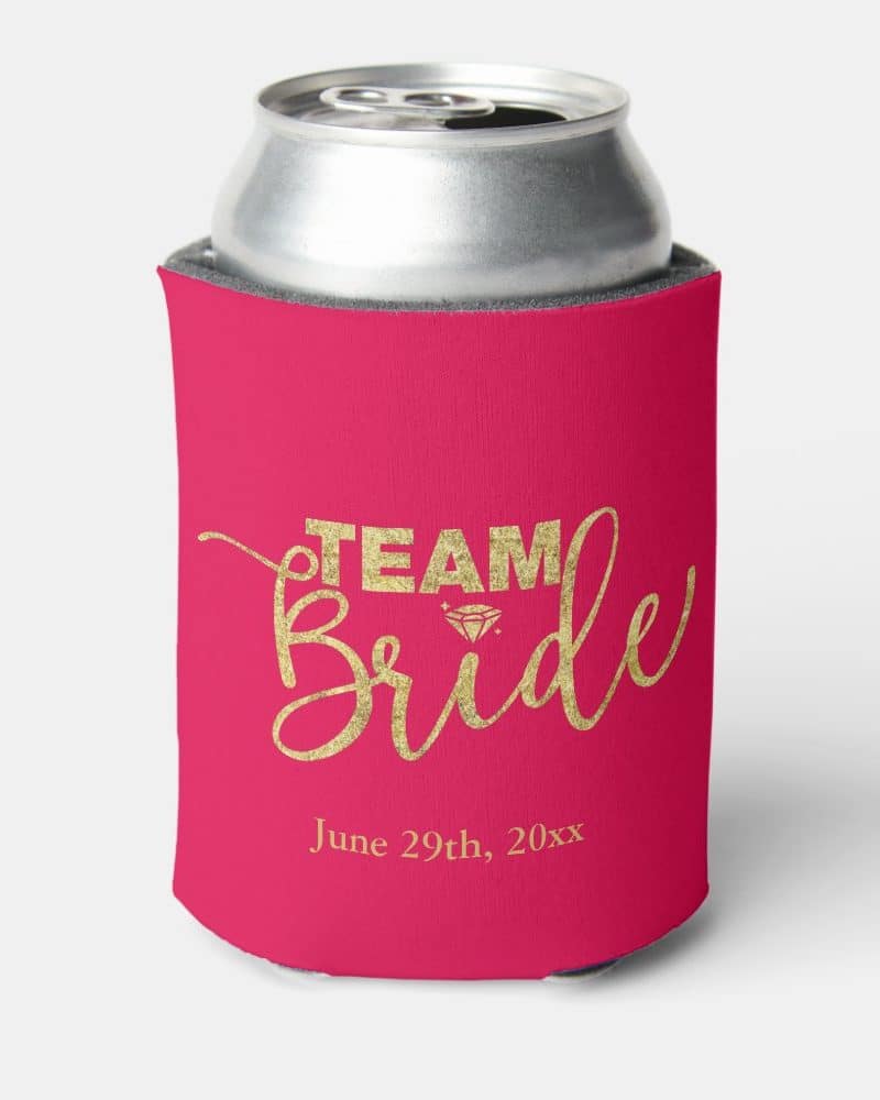 Pink can cooler with gold lettering that says Team Bride and a date.