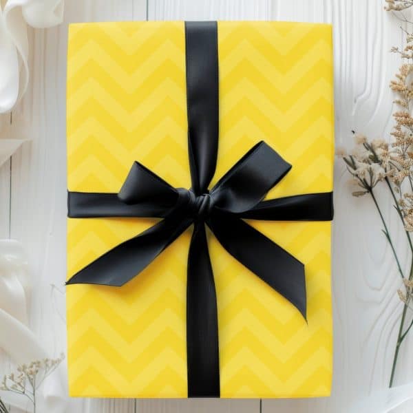 Yellow Gift Box With Black Ribbon Bow.