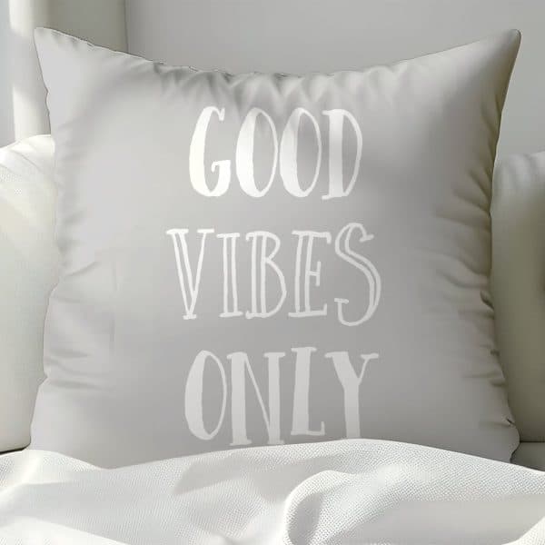 Light Gray Pillow With The Words Good Vibes Only In White.