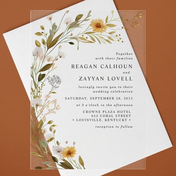 Wedding Invitation For Reagan Calhoun And Zayyan Lovell, Featuring A Floral Border.