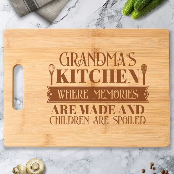 Engraved Bamboo Cutting Board With The Text Grandma'S Kitchen Where Memories Are Made And Children Are Spoiled.