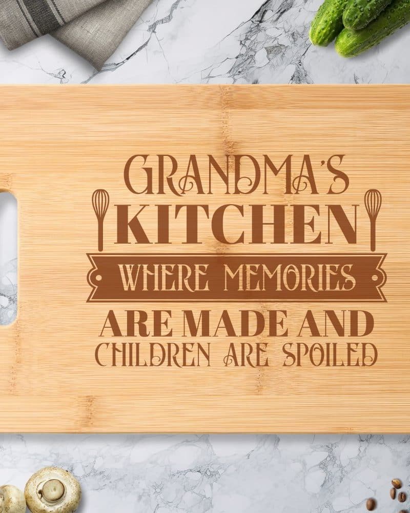 Engraved bamboo cutting board with the text Grandma's Kitchen where memories are made and children are spoiled.