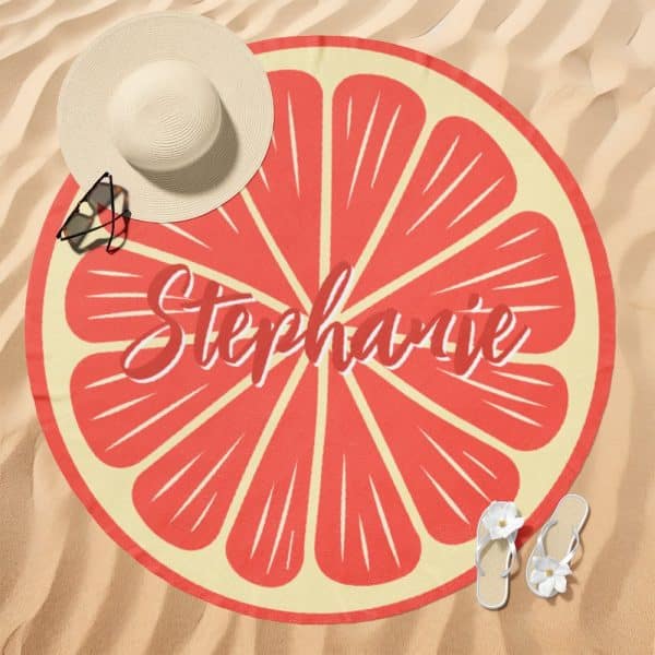 Round Beach Towel With A Grapefruit Design And The Name Stephanie.