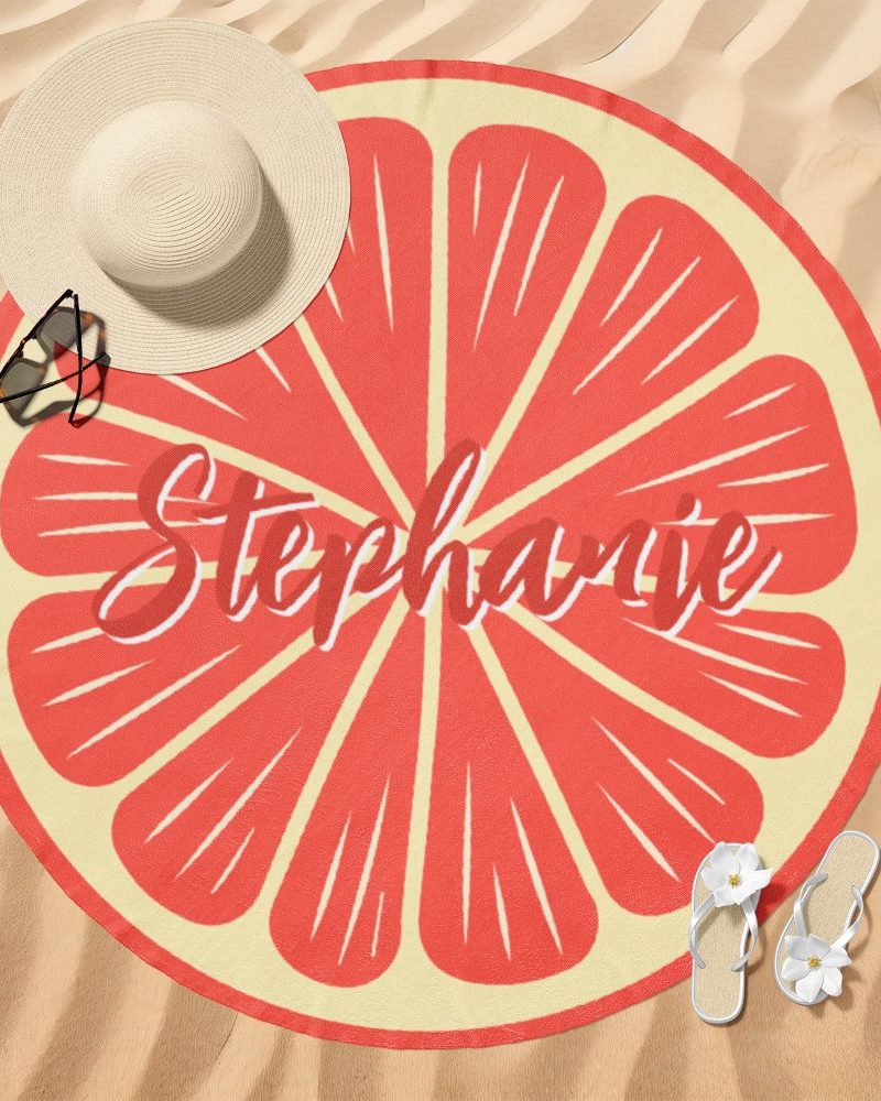 Round beach towel with a grapefruit design and the name Stephanie.