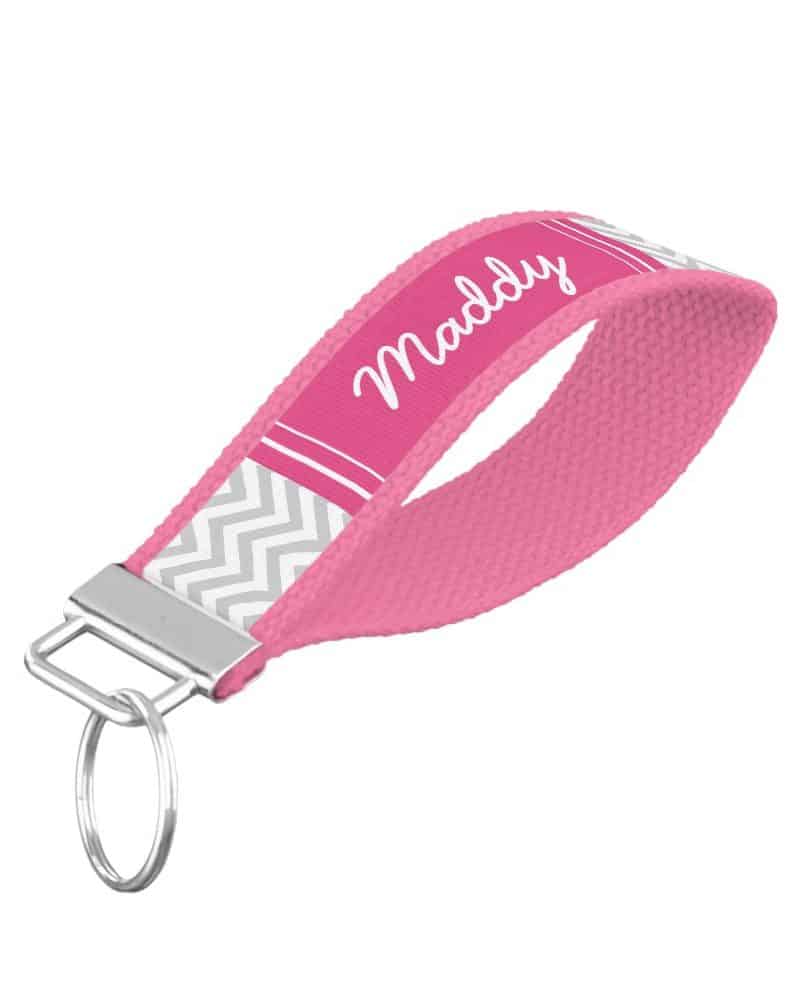 Pink personalized keychain with the name Maddy and a gray chevron pattern.