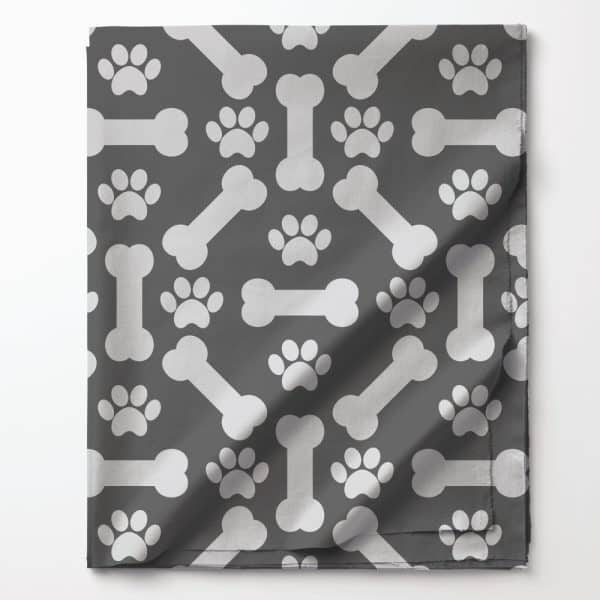 Gray Fabric With A Repeating Pattern Of White Dog Bones And Paw Prints.