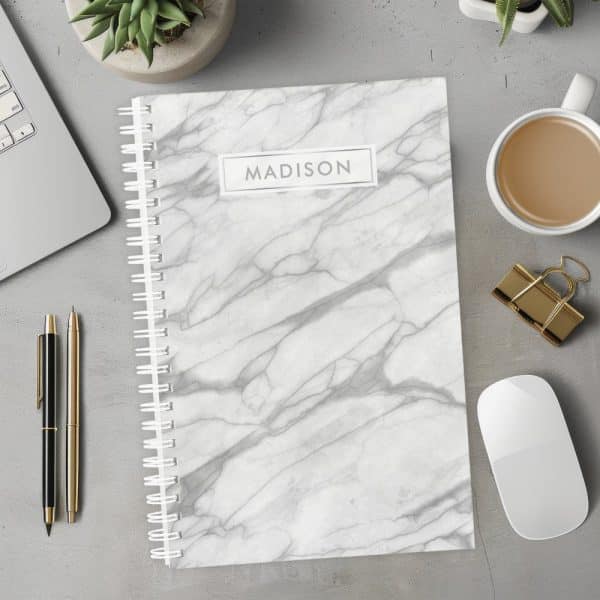 Spiral-Bound Notebook With A Gray Marble Design And The Name Madison On The Cover.