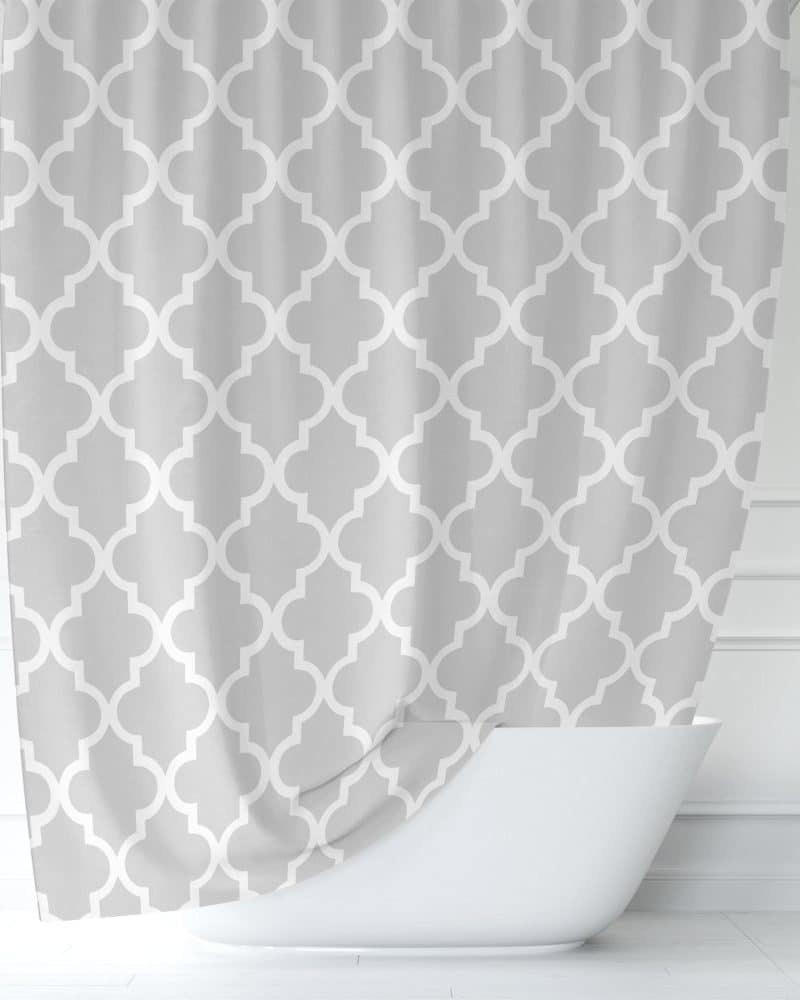 Gray shower curtain with a white quatrefoil pattern.