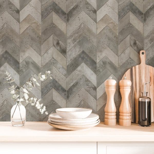 Chevron Patterned Grey And Beige Backsplash With Kitchenware.