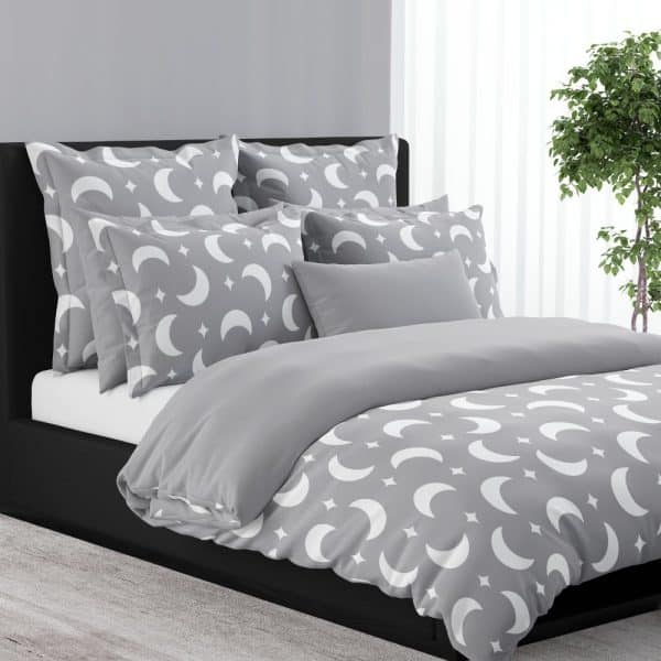 Gray Duvet Cover And Pillows With A White Crescent Moon And Star Pattern.