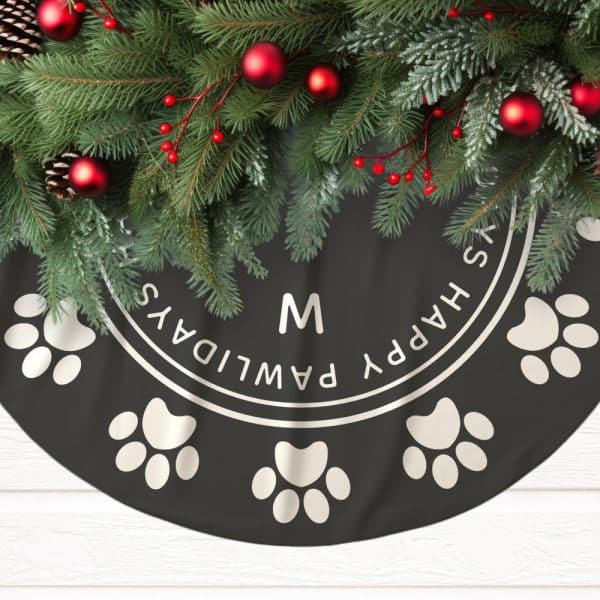 Black Christmas Tree Skirt Decorated With Paw Prints And The Words Happy Pawlidays, Personalized With The Initial M.